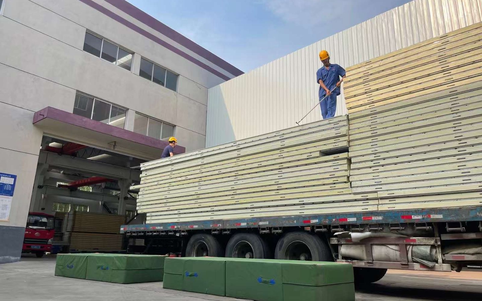 Insulated cold room panels loaded on truck for a large storage project