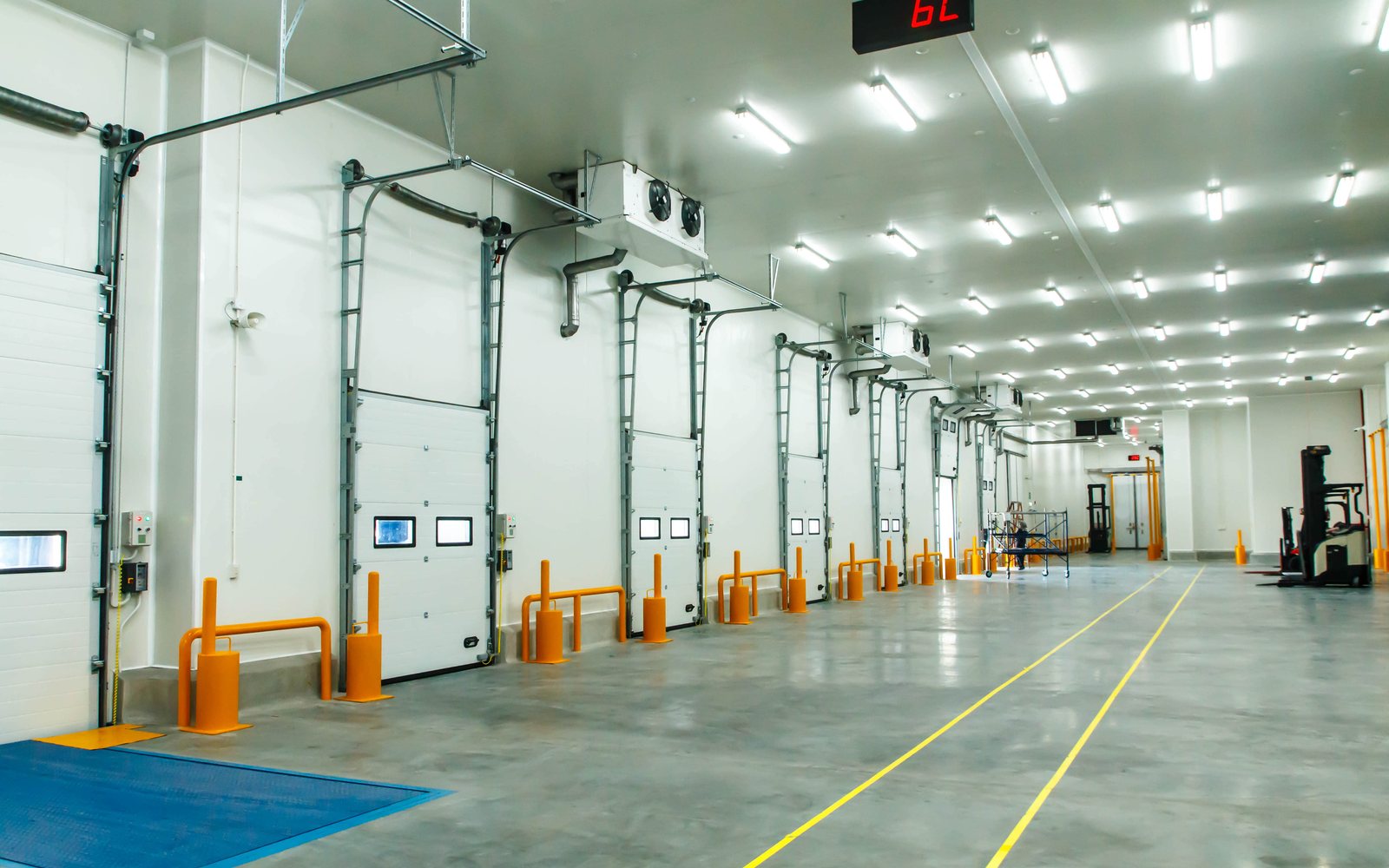 Large cold storage loading area with insulated doors and ceiling unit coolers